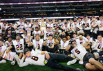 The Bearcats celebrate after wining theier 12th state title.